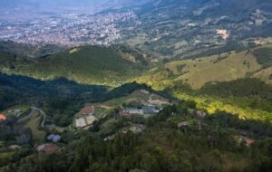 Stunning aerial shot of Medellín offering a panoramic view of the lush valleys and urban landscape.